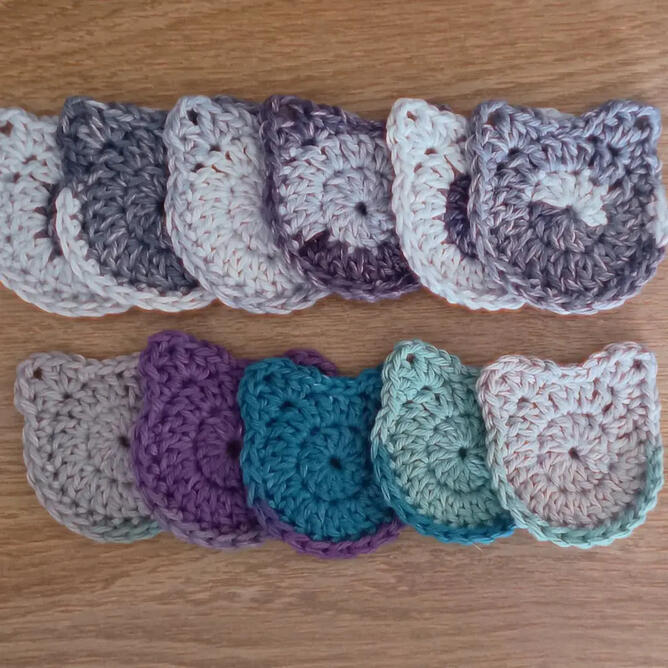Cat Car Coasters Crocheted car coasters shaped like cat heads.